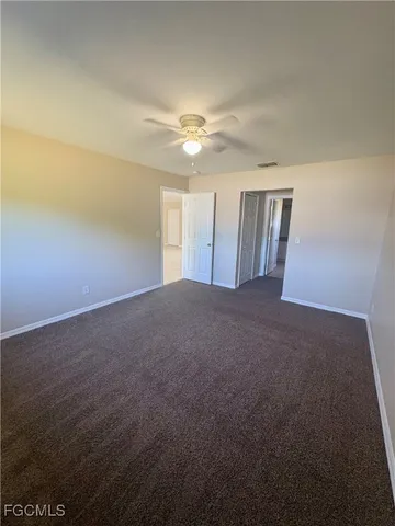 a view of empty room with windows