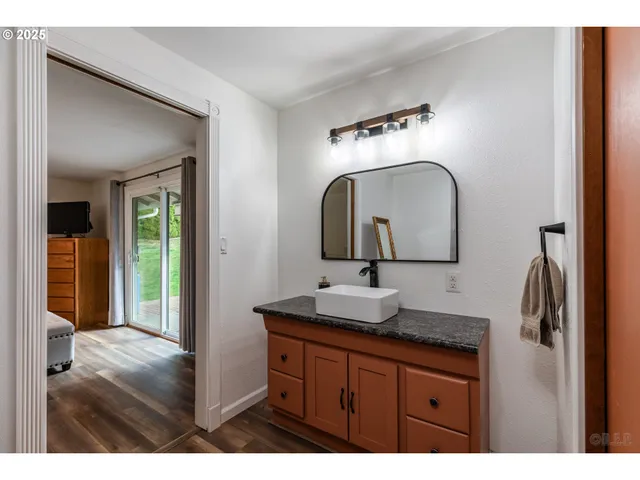 a bathroom with 2 sink and a mirror