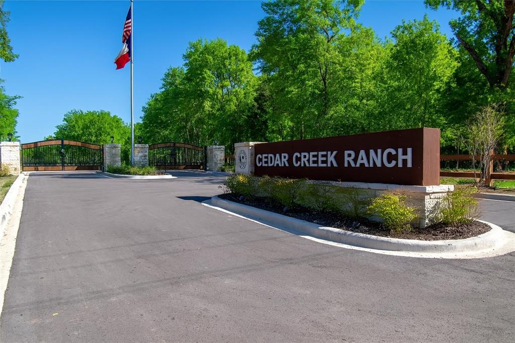 6995 Lakeshore Way Eustace, TX 75124 - Photo 7 of 14 a street sign on a sidewalk next to a road