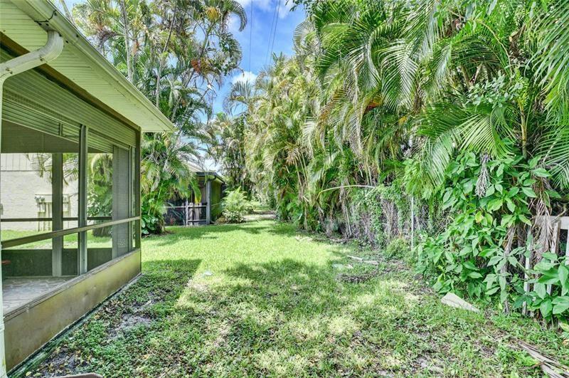9316 Ketay Circle Boca Raton, FL 33428 - Photo 27 of 30 a view of a yard with plants and large trees