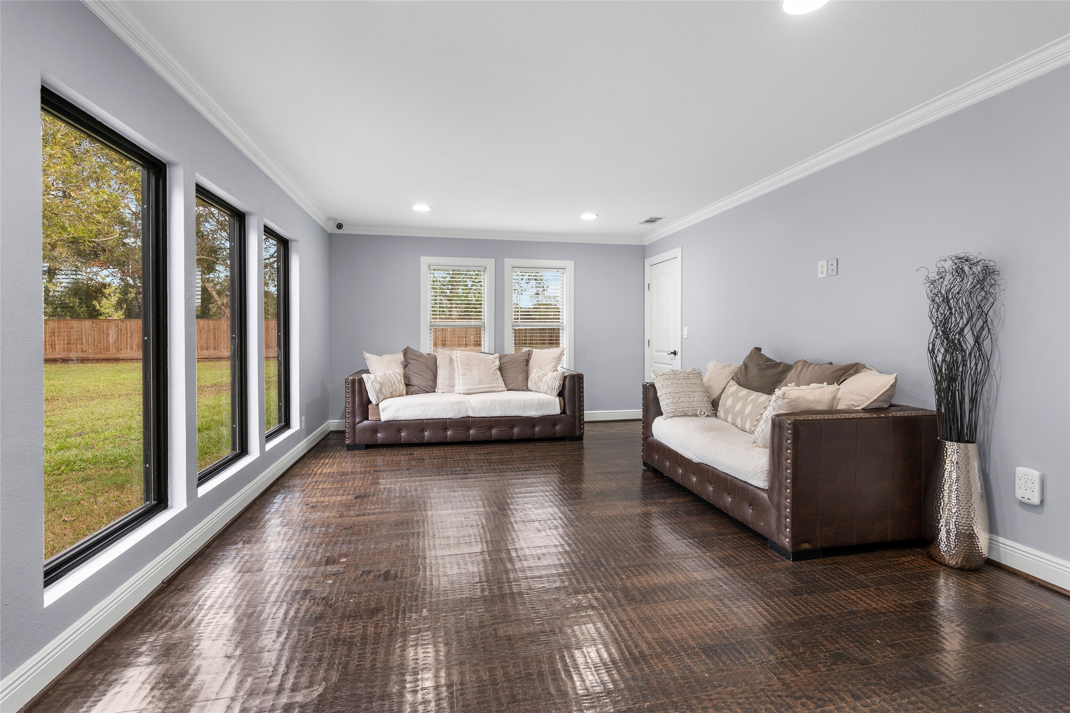 1022 Brooks Avenue Rosenberg, TX 77471 - Photo 11 of 36 a bedroom with furniture and large windows