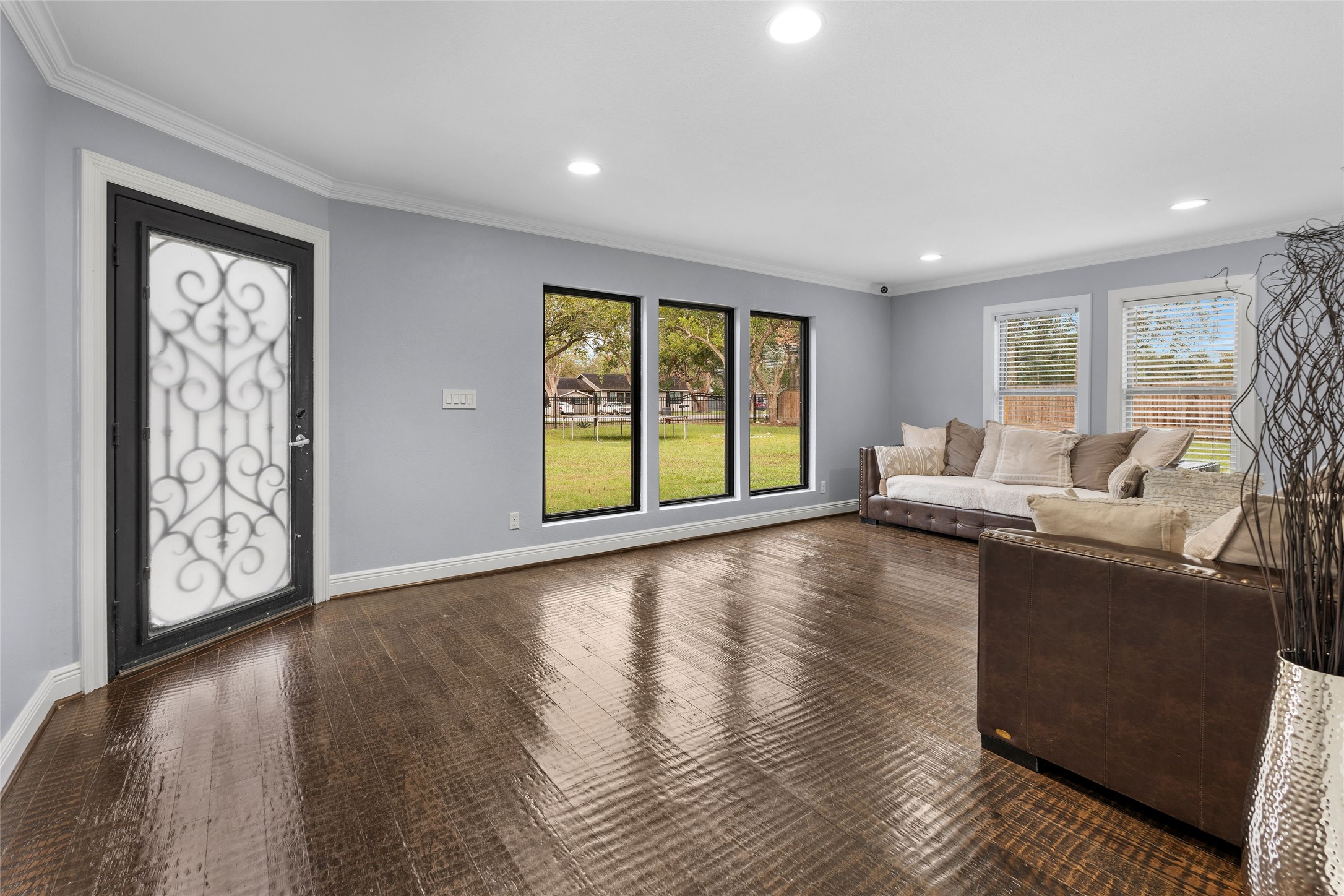 1022 Brooks Avenue Rosenberg, TX 77471 - Photo 12 of 36 a living room with furniture and a large window