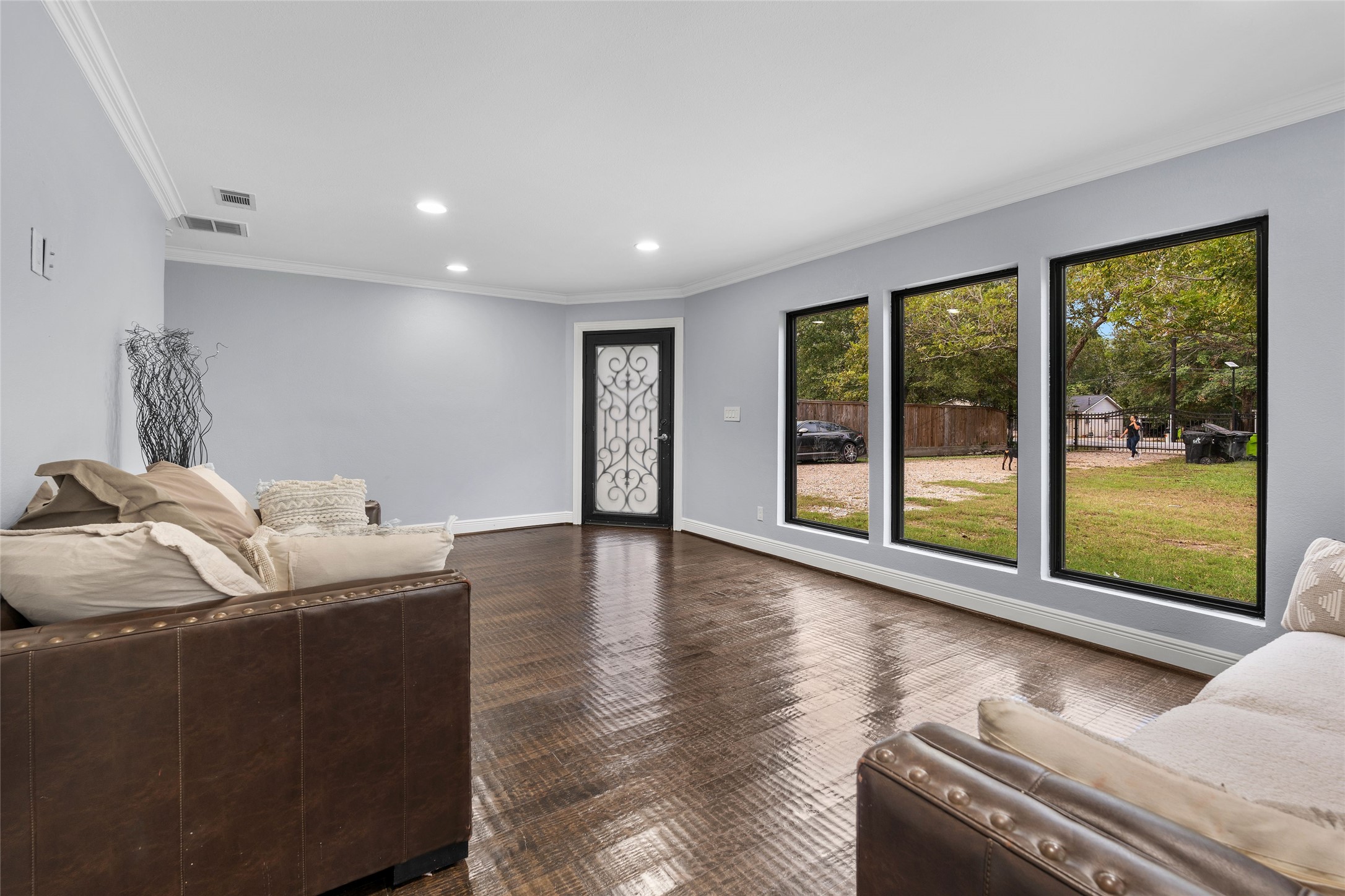 1022 Brooks Avenue Rosenberg, TX 77471 - Photo 13 of 36 a living room with furniture and large windows