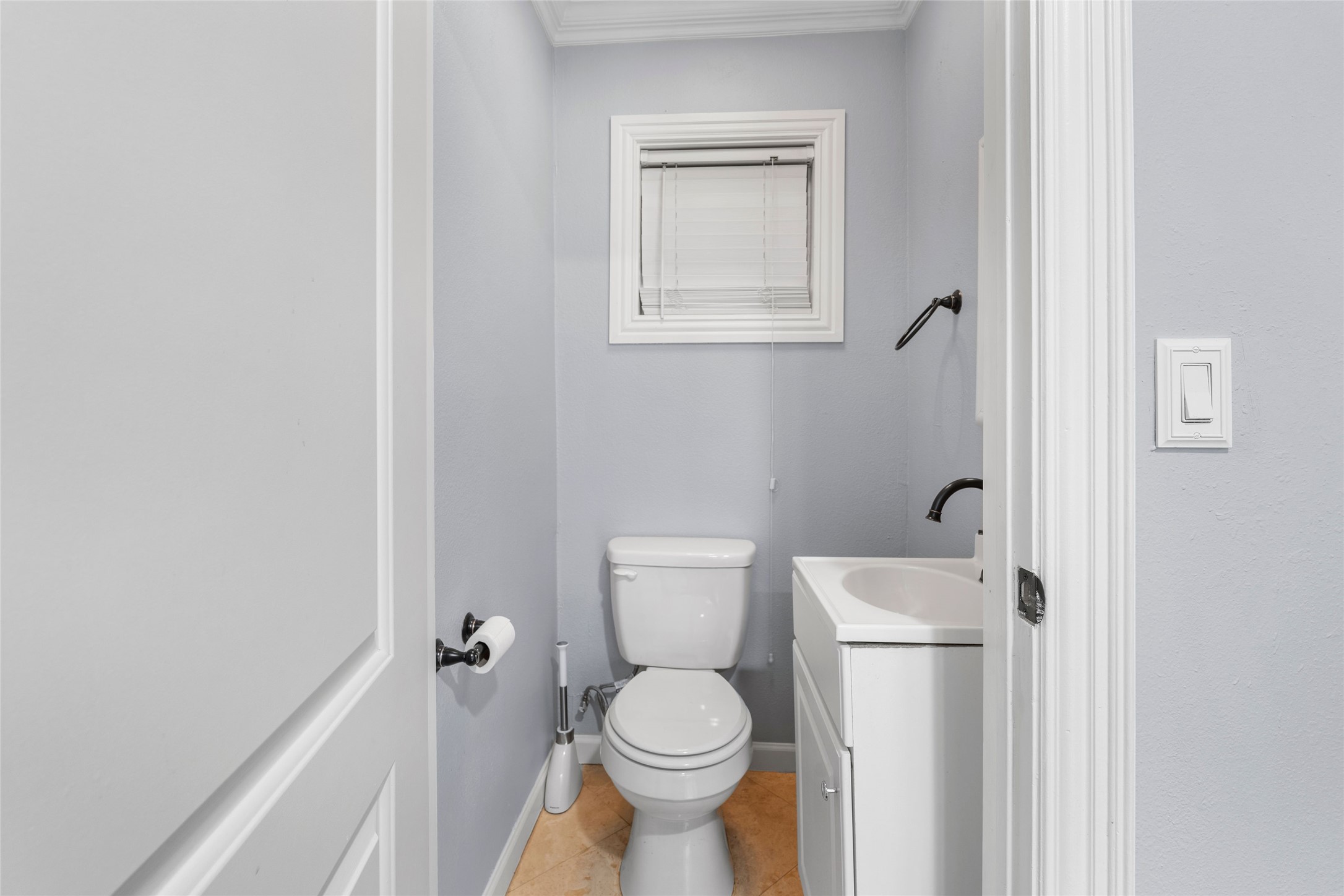 1022 Brooks Avenue Rosenberg, TX 77471 - Photo 14 of 36 a white toilet sitting next to a bathroom sink