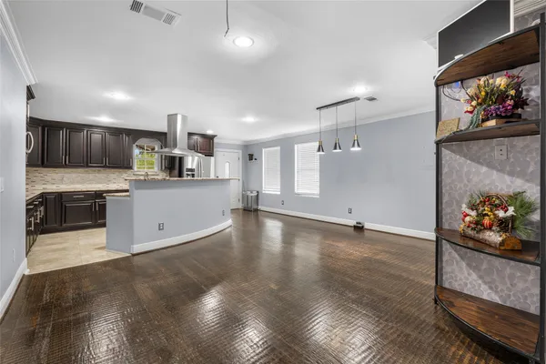 a view of a kitchen with microwave and cabinets