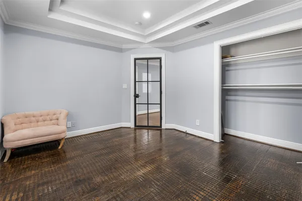 a view of an empty room and wooden floor