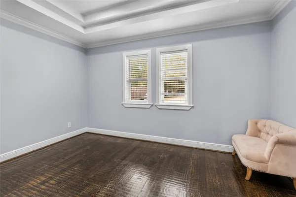 a room with a chair and a window