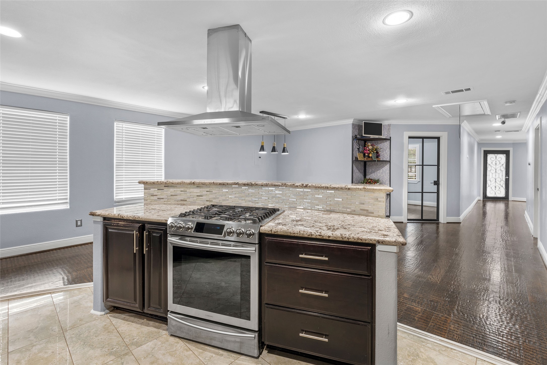 1022 Brooks Avenue Rosenberg, TX 77471 - Photo 2 of 36 a kitchen with a stove and a wooden floor
