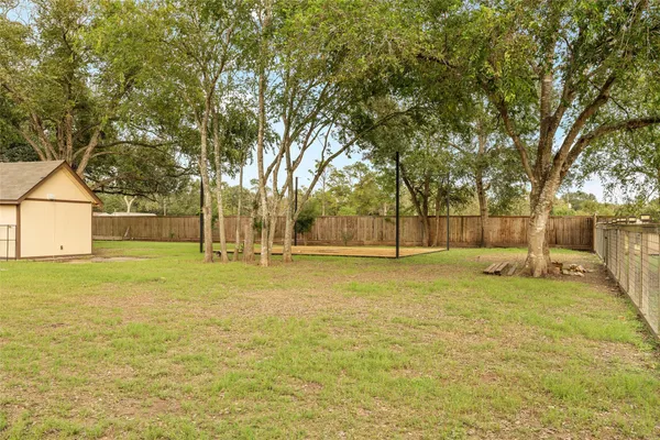 a view of a yard with swimming pool