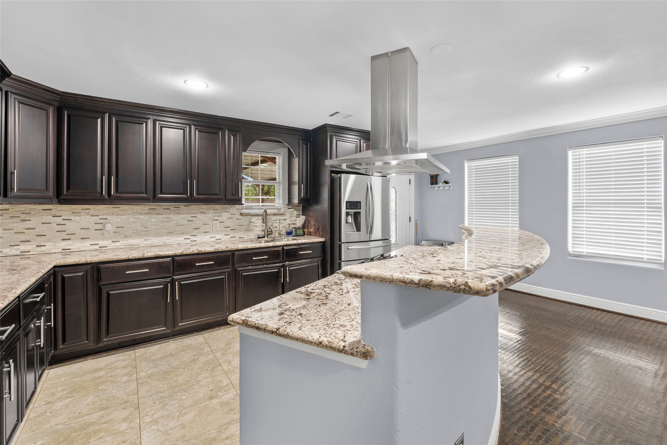 1022 Brooks Avenue Rosenberg, TX 77471 - Photo 3 of 36 a kitchen with stainless steel appliances granite countertop a sink and stove