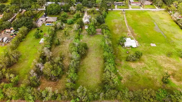 a view of a yard with swimming pool