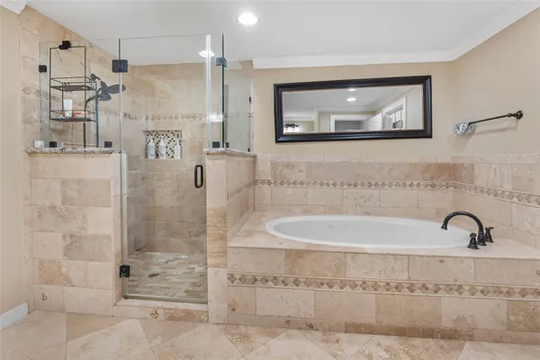 a bathroom with a bathtub and a shower