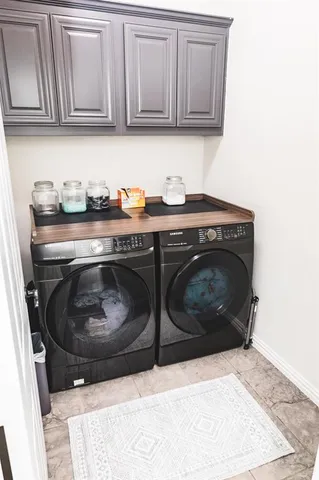 a close view of a stove and cabinets in a room