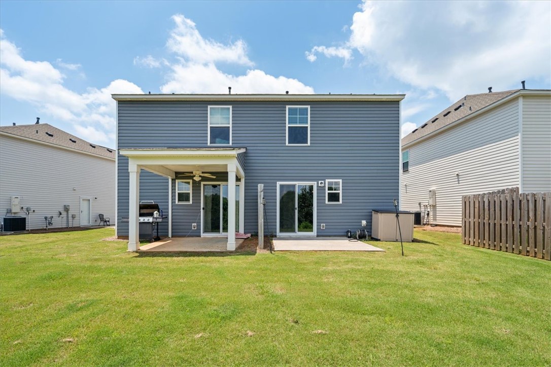115 Adger Road Pendleton, SC 29670 - Photo 36 of 36 A spacious backyard awaits, featuring a covered patio for outdoor enjoyment.