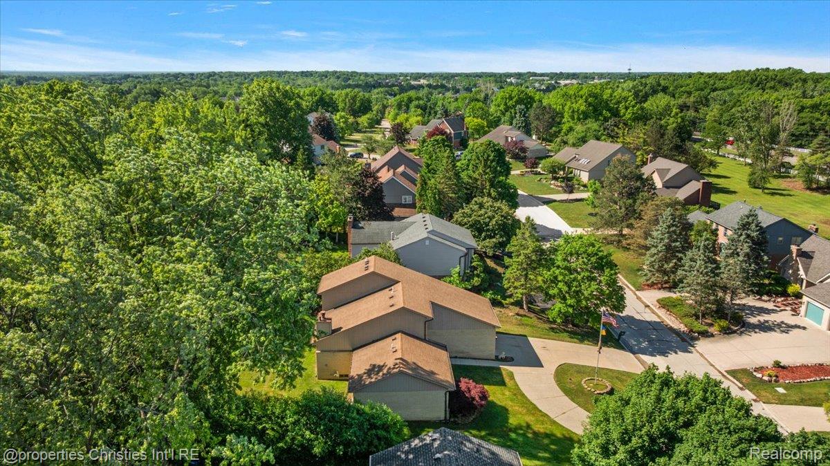 37224 Chesapeake Road Farmington, MI 48335 - Photo 15 of 50 Aerial perspective showcasing a residential neighborhood with ample tree coverage