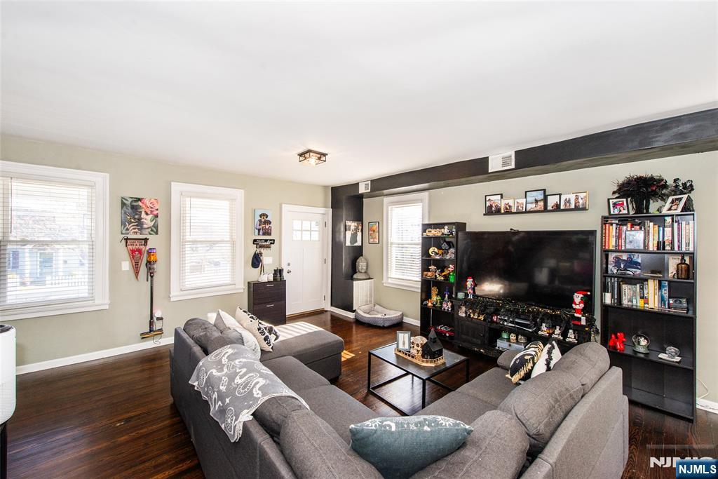 405 Washington Street Boonton, NJ 07005 - Photo 16 of 26 a living room with furniture and a flat screen tv