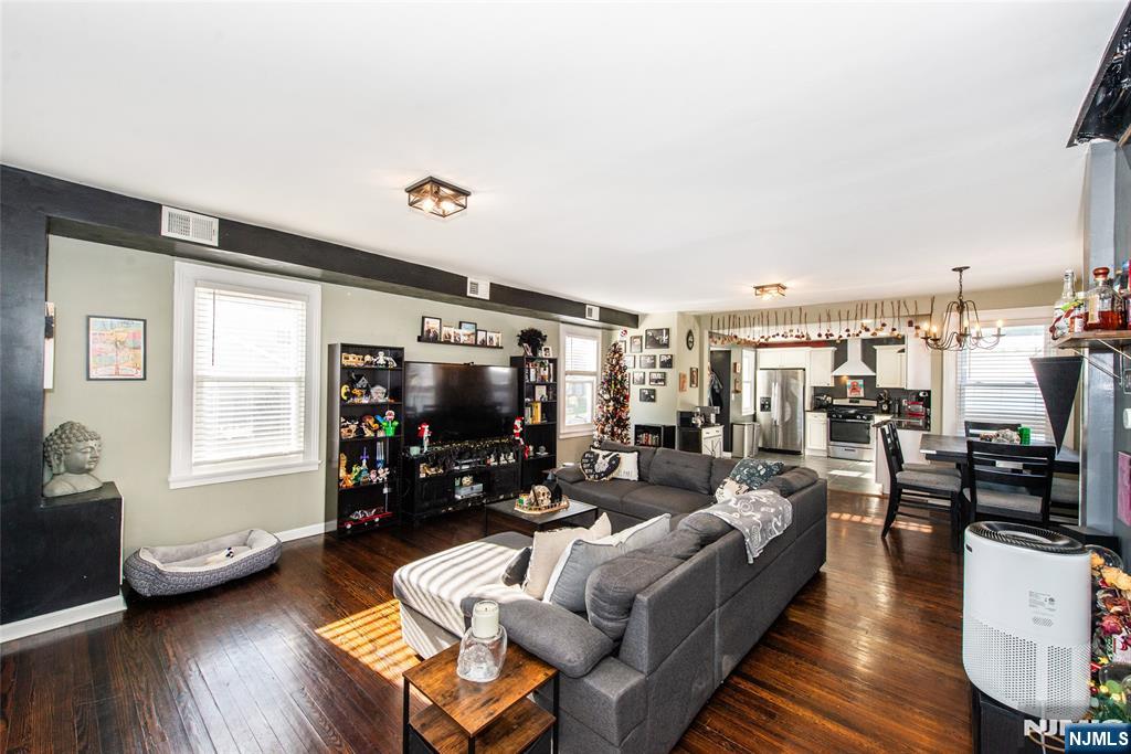 405 Washington Street Boonton, NJ 07005 - Photo 17 of 26 a living room with furniture and a flat screen tv