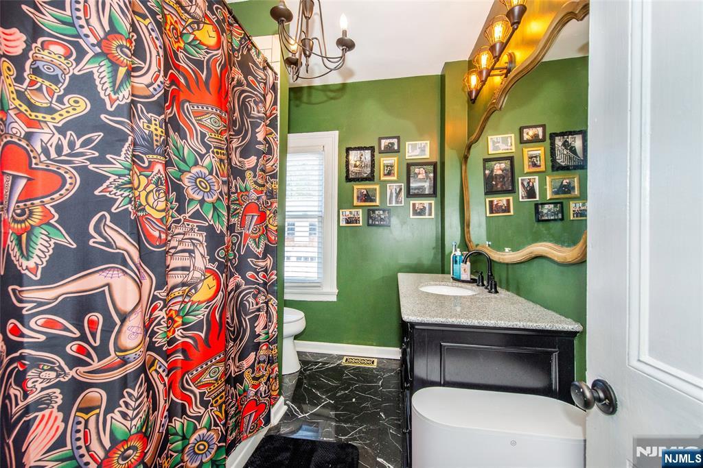 405 Washington Street Boonton, NJ 07005 - Photo 24 of 26 a bathroom with a toilet and a sink