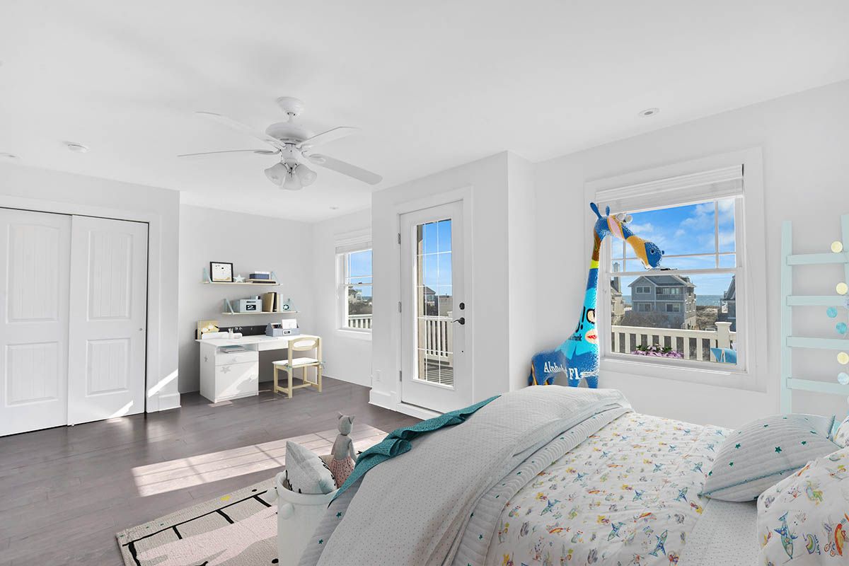 798 Dune Road Westhampton Beach, NY 11978 - Photo 15 of 22 a bedroom with a bed and a couch