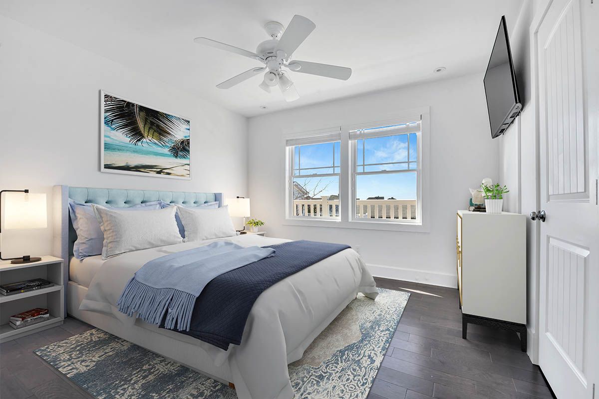 798 Dune Road Westhampton Beach, NY 11978 - Photo 18 of 22 a bedroom with a large bed and a window