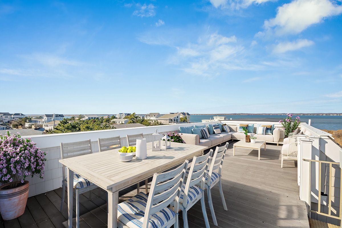 798 Dune Road Westhampton Beach, NY 11978 - Photo 19 of 22 an outdoor space with furniture and city view