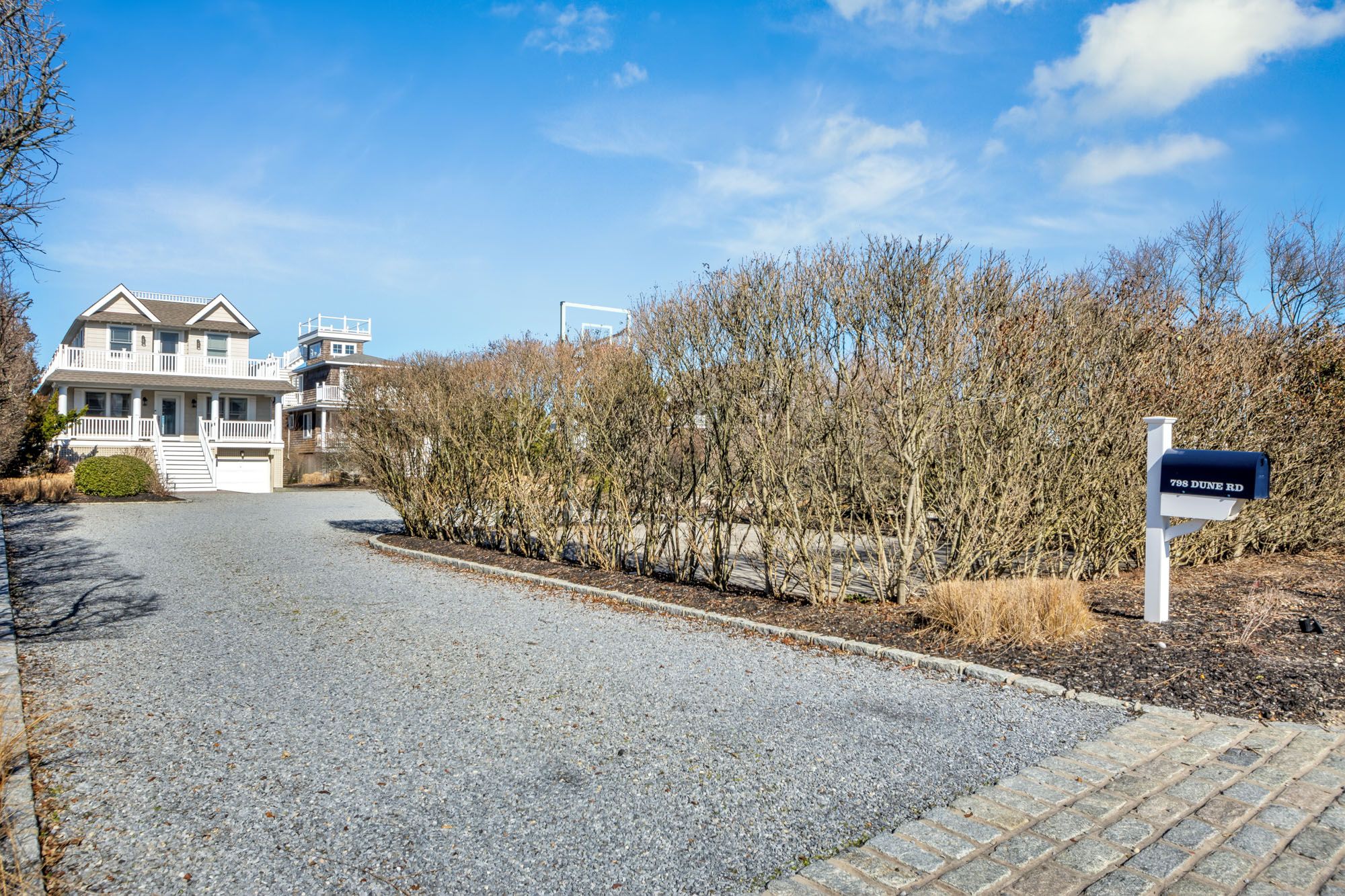 798 Dune Road Westhampton Beach, NY 11978 - Photo 21 of 22 a view of a house with a yard and mountain view in back