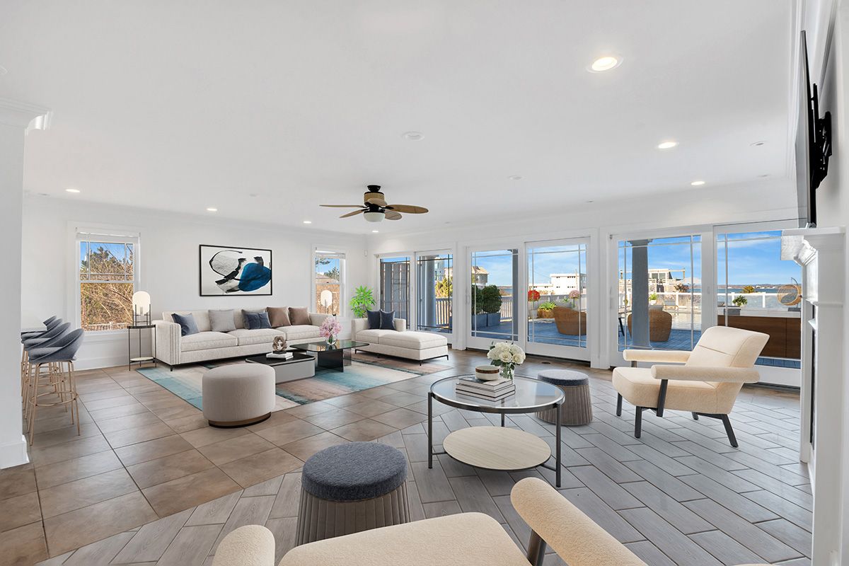 798 Dune Road Westhampton Beach, NY 11978 - Photo 6 of 22 a living room with lots of furniture and a view of kitchen
