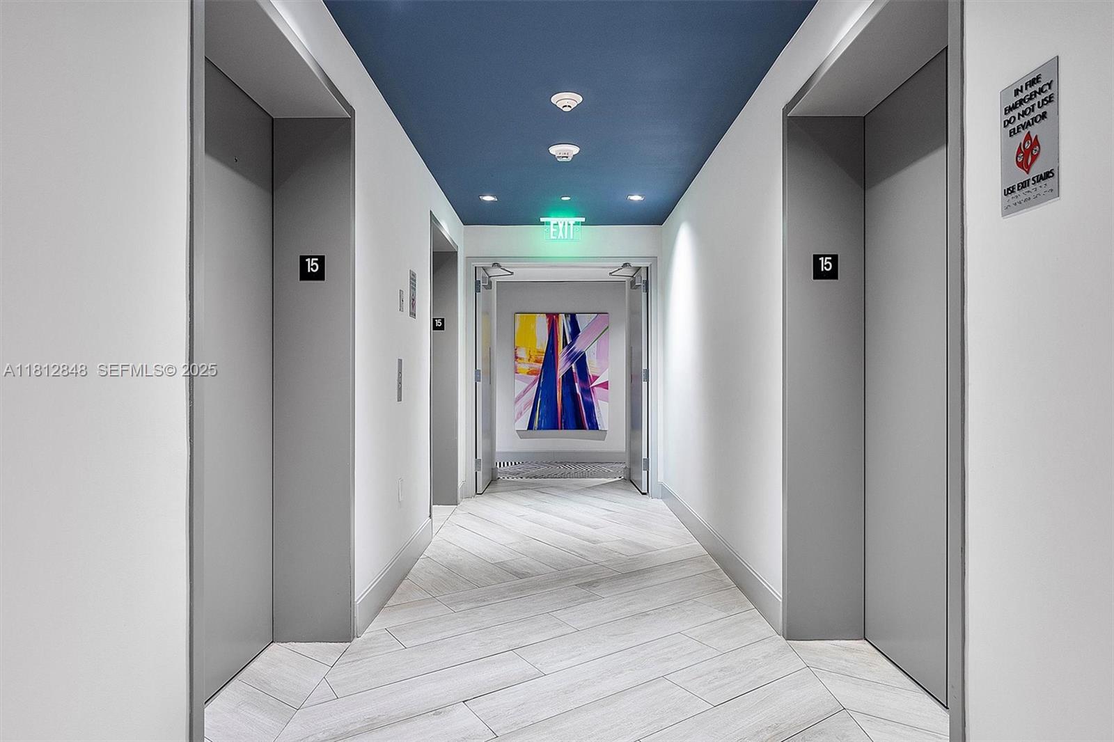 55 Southwest 9th Street, Unit 1510 Miami, FL 33130 - Photo 24 of 46 a view of a hallway with wooden shelves