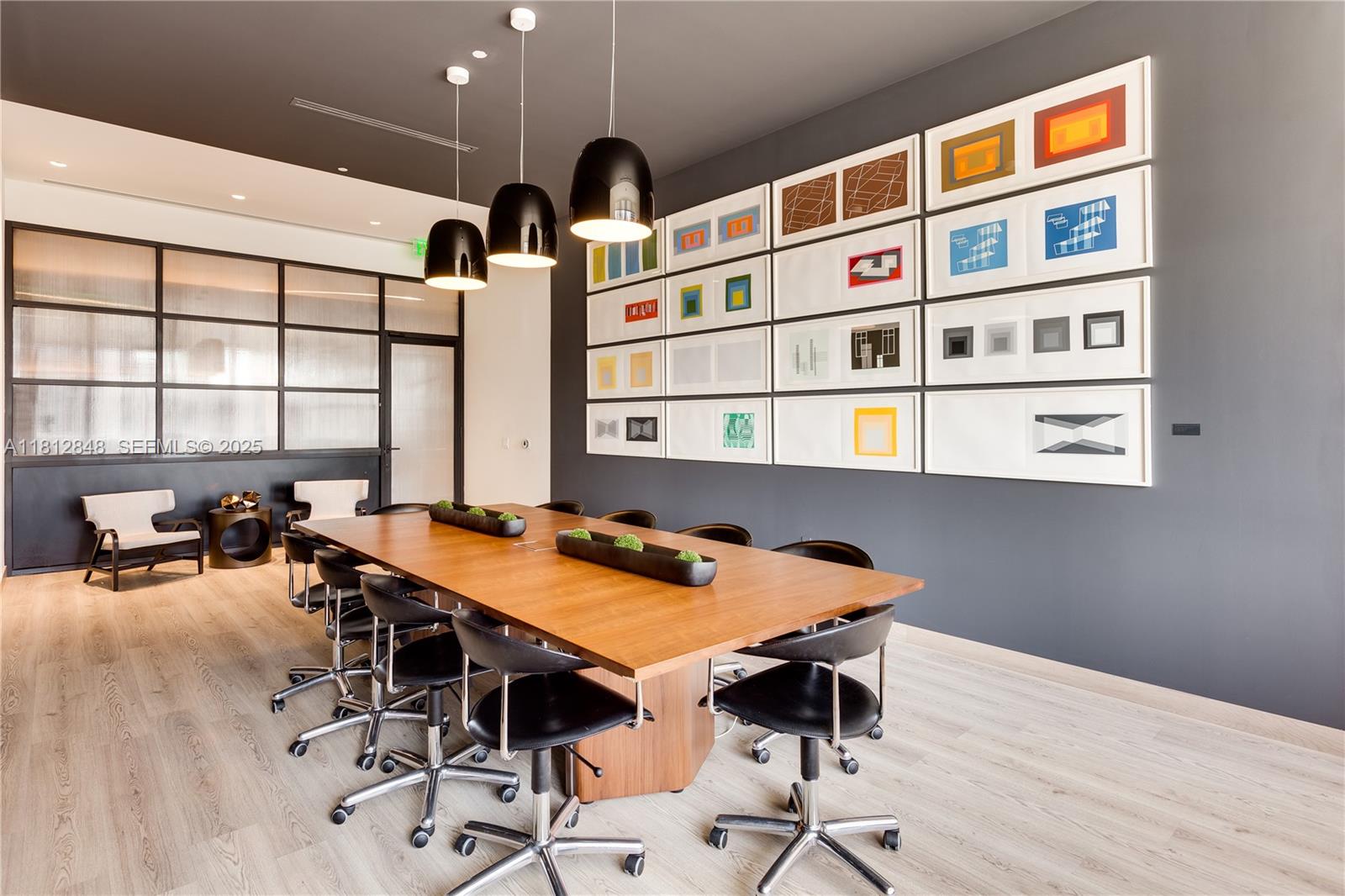 55 Southwest 9th Street, Unit 1510 Miami, FL 33130 - Photo 35 of 46 a view of a room that has a table and chairs in it