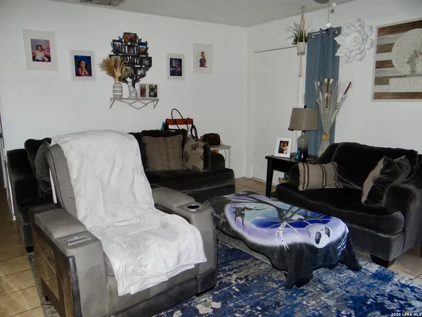 a living room with furniture and a couch