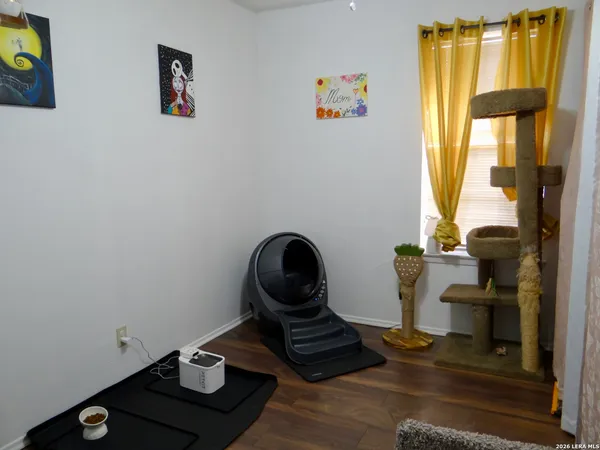 a room with toys and wooden floor