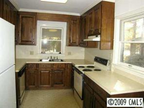 111 McAlway Road Charlotte, NC 28211 - Photo 4 of 8 a kitchen with a sink a stove and cabinets
