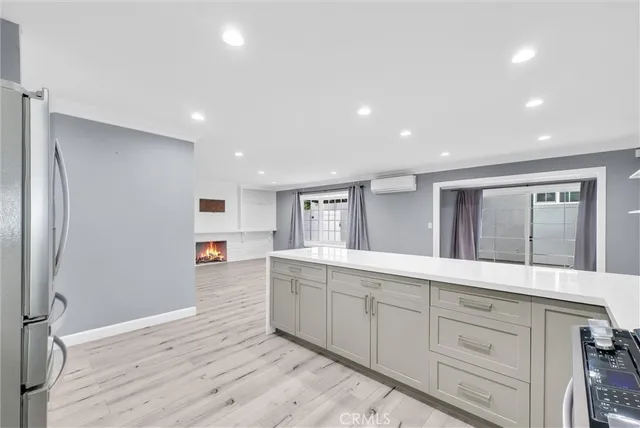 a spacious bathroom with a granite countertop sink and a large mirror