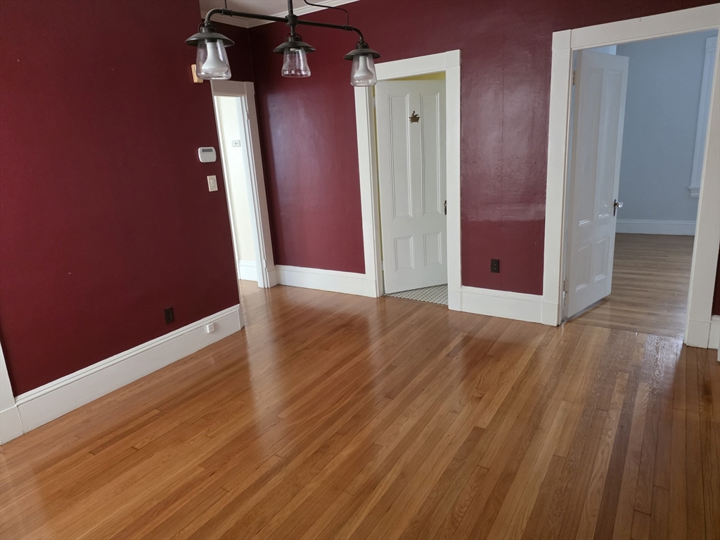 177 Highland Avenue, Unit 1 Fall River, MA 02720 - Photo 17 of 36 a view of a hallway with wooden floor