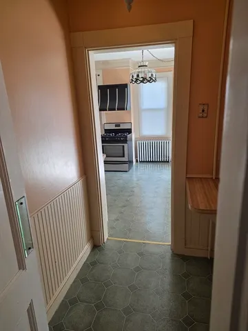 a view of a hallway view with staircase