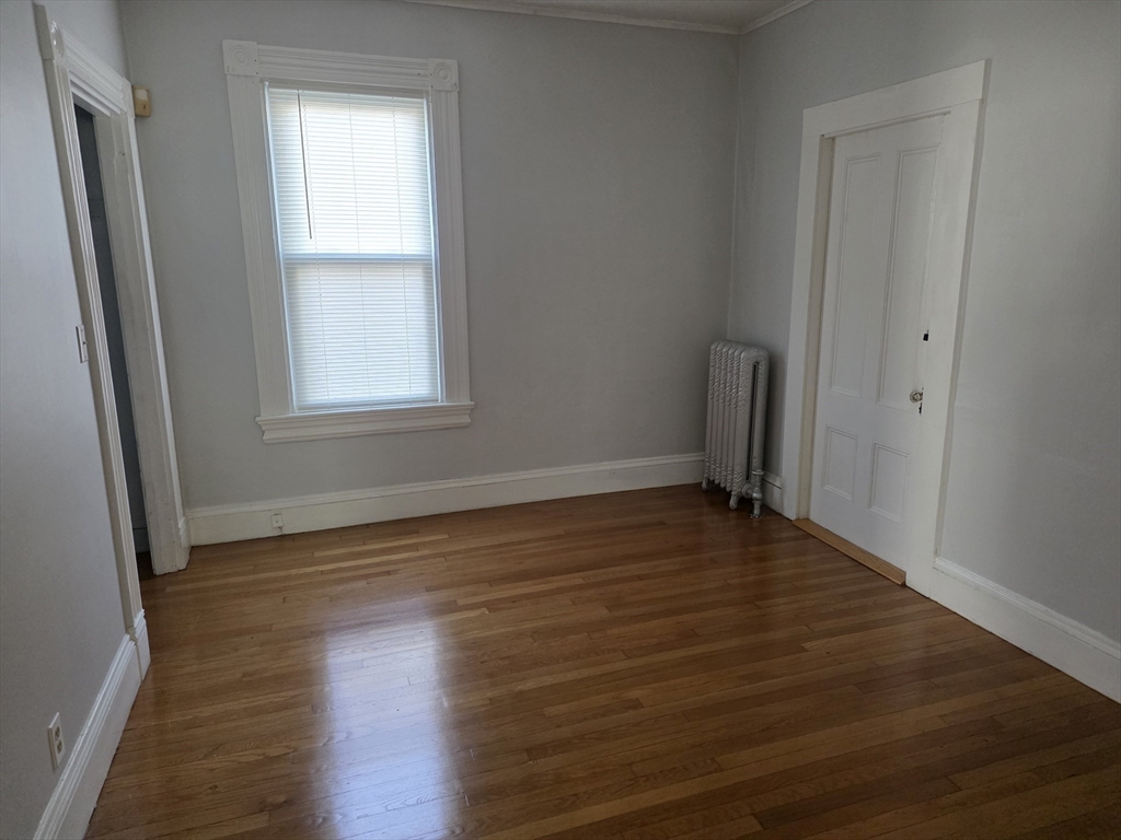 177 Highland Avenue, Unit 1 Fall River, MA 02720 - Photo 30 of 36 a view of a room with wooden floor and window