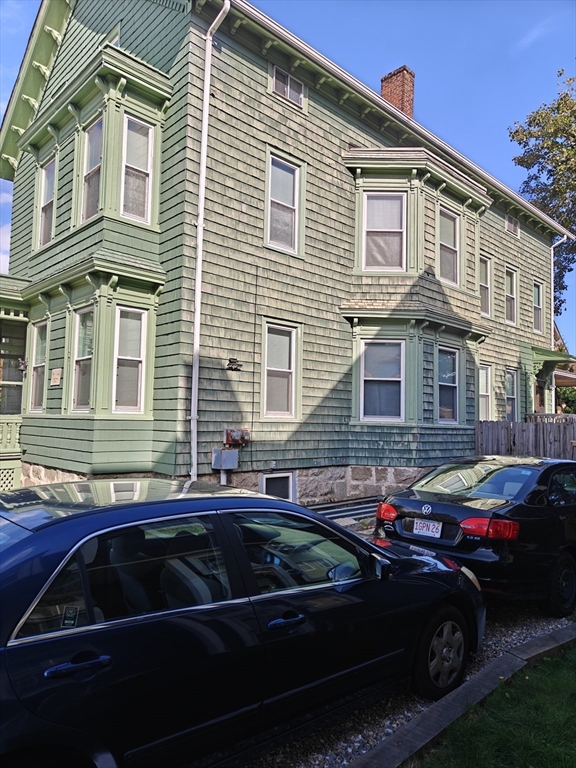 177 Highland Avenue, Unit 1 Fall River, MA 02720 - Photo 3 of 36 a couple of cars parked in front of a house