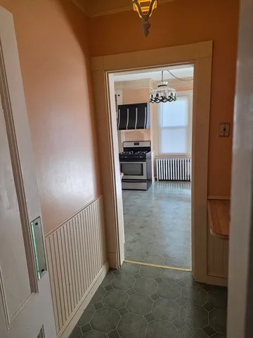 a view of a hallway view with staircase