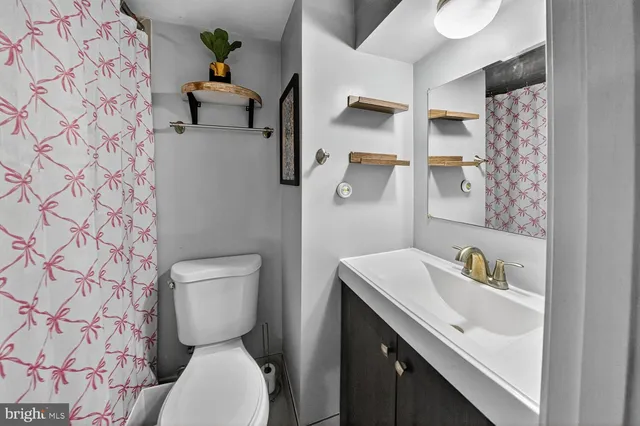 a bedroom with a bed and a book shelf