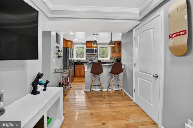 a bathroom with a sink vanity and mirror