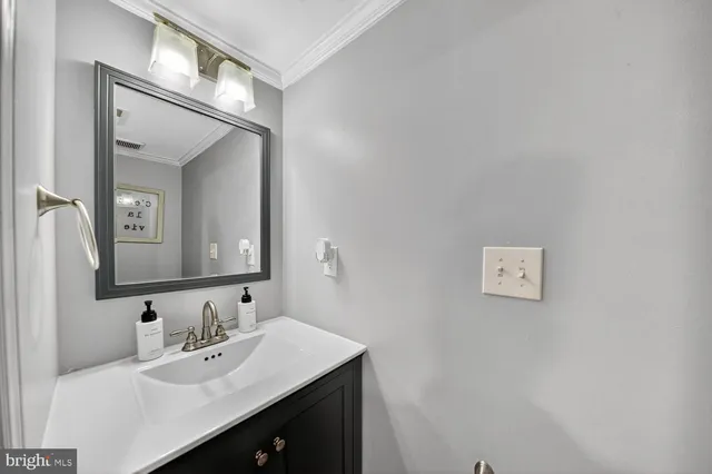 a spacious bedroom with a bed dresser and a window