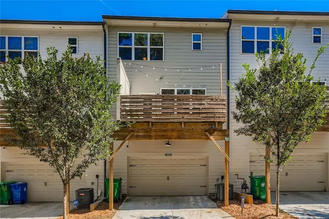 a front view of a house with trees