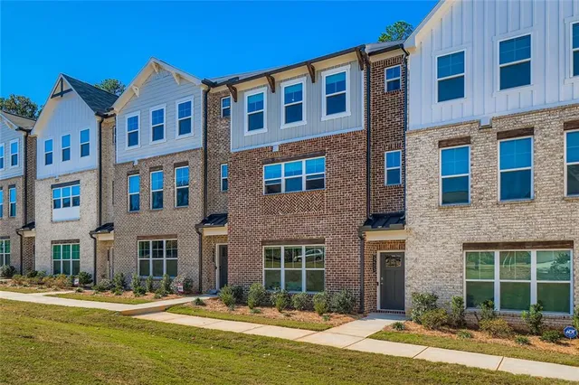 a front view of a building with a swimming pool
