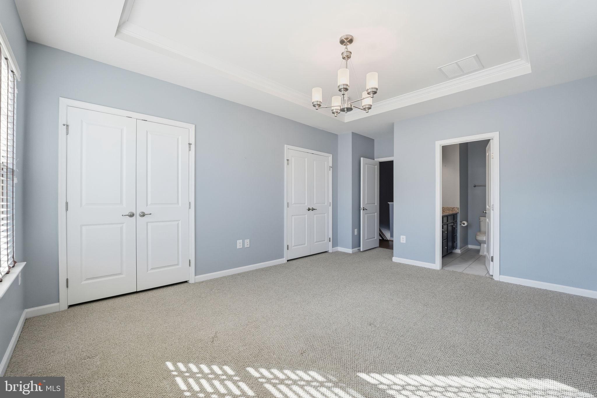 14619 Featherstone Gate Drive Woodbridge, VA 22191 - Photo 14 of 20 a view of an empty room with a chandelier