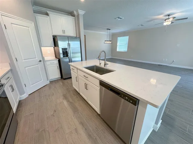 a view of a lake with trees in the background