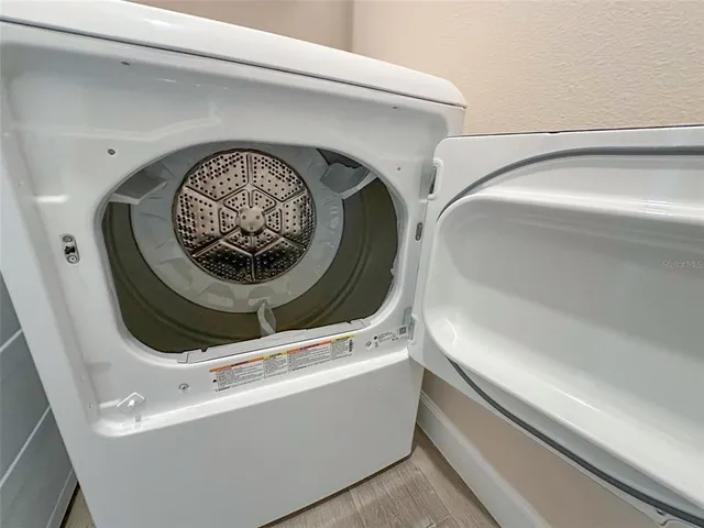 a spacious bathroom with double vanity and mirrors