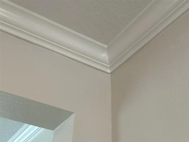 an aerial view of a house with garden space and lake view