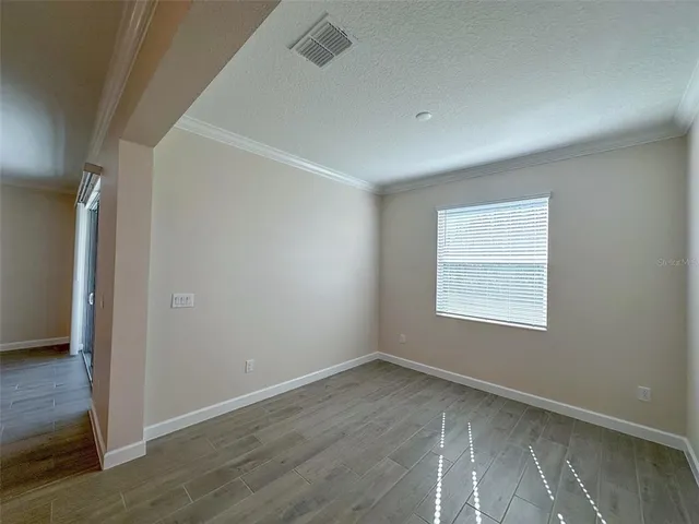 a swimming pool with outdoor seating and yard