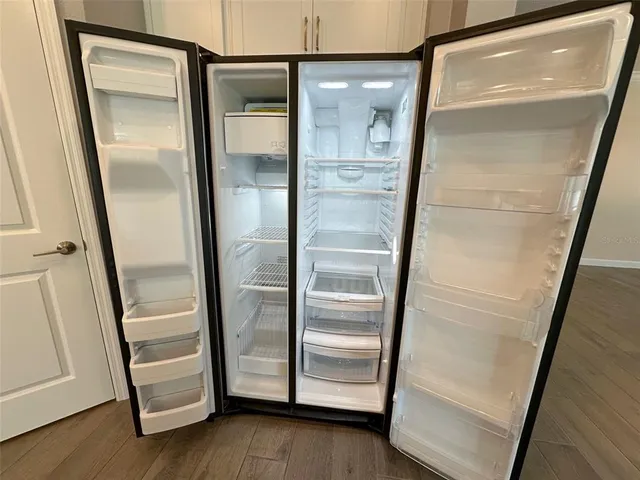 a stove top oven sitting inside of a kitchen