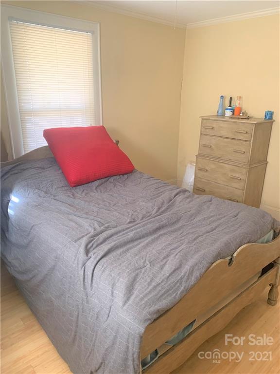 4215 Poplar Tent Road Concord, NC 28027 - Photo 13 of 22 a bedroom with a bed and window